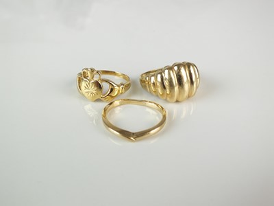 Lot 245 - Three yellow metal rings