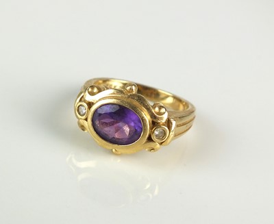 Lot 176 - A yellow metal amethyst and diamond ring