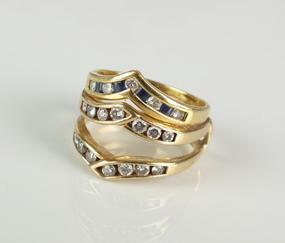 Lot 167 - An 18ct gold and yellow metal diamond and sapphire three band herringbone ring