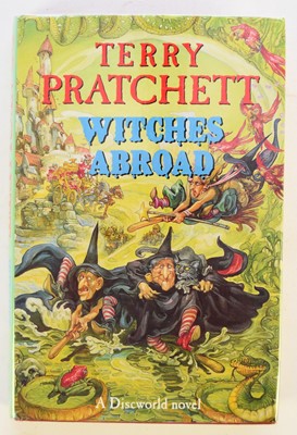 Lot 79 - PRATCHETT, Terry, Witches Abroad, 1st edition 1991. Signed by the author on the title page. In dust wrapper. Not price-clipped?
