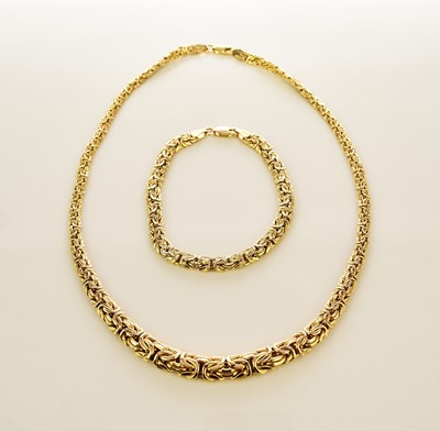 Lot 136 - A yellow metal necklace and bracelet suite