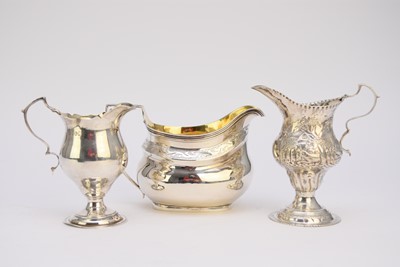 Lot 60 - Three silver cream jugs