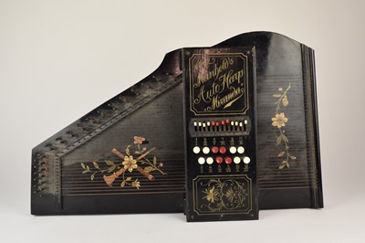 Lot 592 - An early 20th century squeeze box, a cased mandolin and a Meinhold's Autoharp Miranda