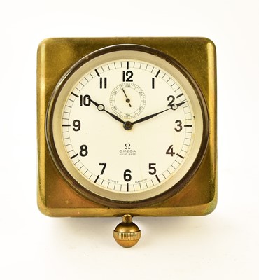 Lot 604 - An Omega brass-mounted car clock