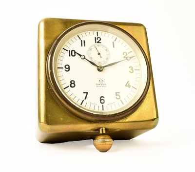 Lot 604 - An Omega brass-mounted car clock