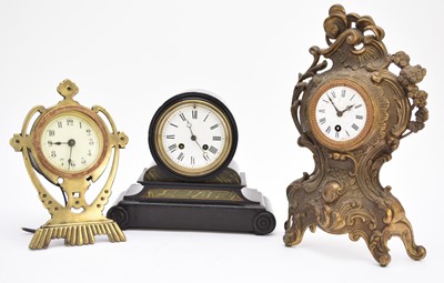 Lot 622 - Two brass-mounted mantel clocks and an ebonised mantel clock