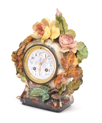 Lot 623 - A French earthenware-cased mantel clock