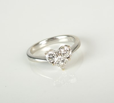 Lot 27 - A three stone diamond ring of heart form