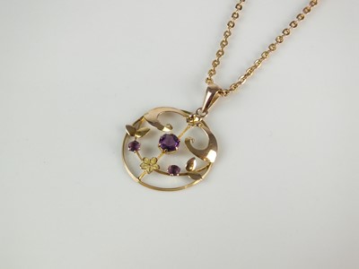 Lot 298 - An early 20th century purple paste set pendant on chain