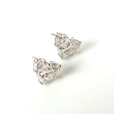 Lot 51 - A pair of 18ct white gold diamond earrings of heart form