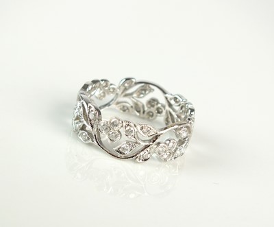 Lot 279 - A diamond set decorative floral pierced band