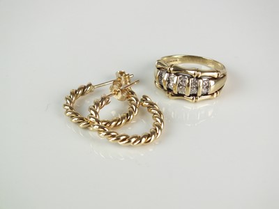 Lot 311 - A 9ct gold diamond set ring and a pair of earrings