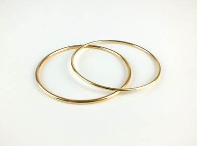 Lot 73 - Two 18ct gold bangles