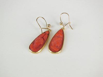 Lot 126 - A pair of carved coral ear pendants