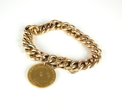 Lot 49 - A yellow metal hollow curb link bracelet with attached sovereign