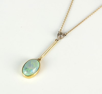 Lot 62 - An opal and diamond pendant on chain