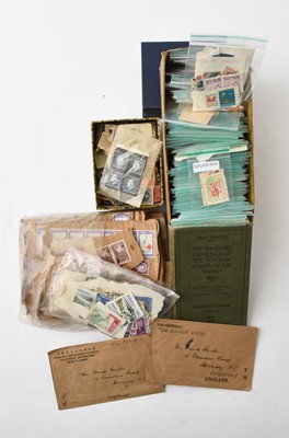 Lot 182 - A box of world stamps containing three albums, a small box of stamps in packets and another "off paper"