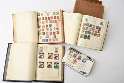 Lot 182 - A box of world stamps containing three albums, a small box of stamps in packets and another "off paper"