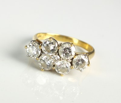 Lot 105 - An 18ct gold seven stone diamond dress ring