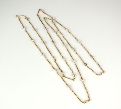 Lot 14 - A yellow metal seed pearl set chain