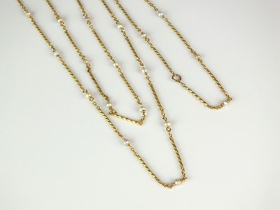 Lot 14 - A yellow metal seed pearl set chain
