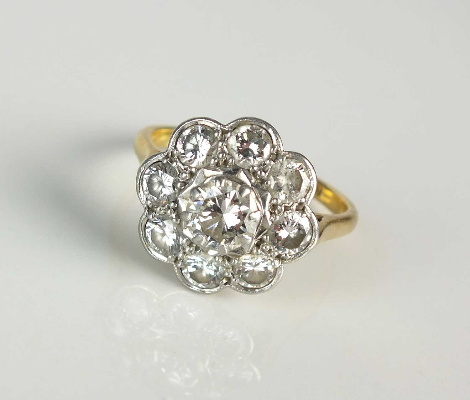 Lot 25 - A diamond floral cluster ring