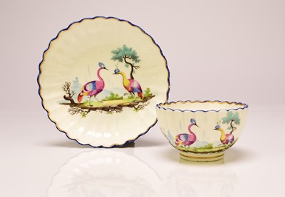 Lot 136 - Caughley polychrome tea bowl and saucer painted with Fancy Birds, circa 1783-93