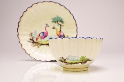 Lot 136 - Caughley polychrome tea bowl and saucer painted with Fancy Birds, circa 1783-93