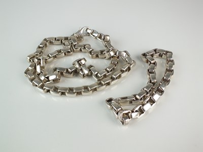 Lot 129 - A silver square link bracelet and white metal necklace