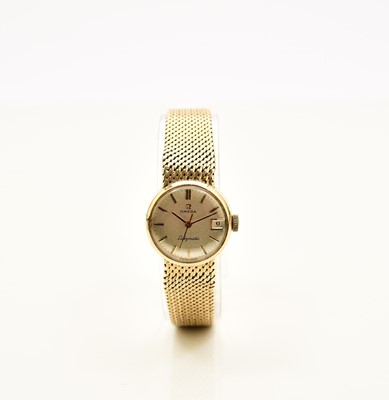 Lot 414 - Omega: A lady's 9ct gold Ladymatic bracelet watch