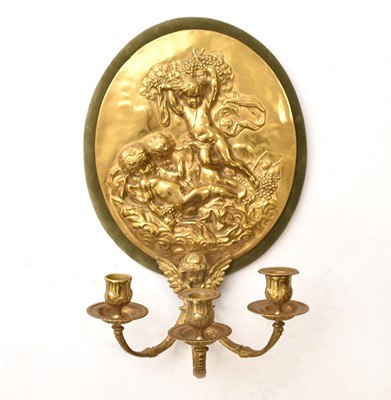 Lot 574 - A pair of reproduction cast brass candle sconces