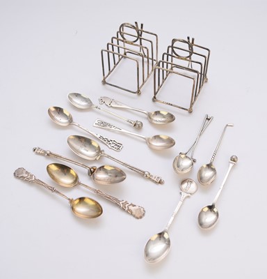 Lot 40 - A pair of golfing interest silver toast racks and silver spoons