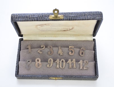 Lot 8 - A cased set of white metal numbers