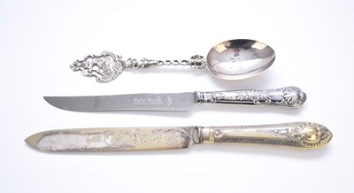 Lot 101 - A continental silver decorative spoon and two cake knives