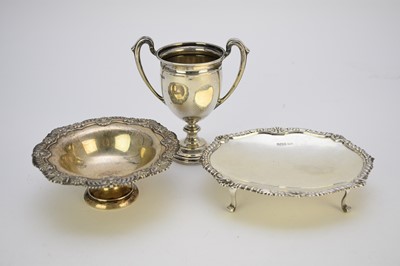 Lot 7 - A silver two handle trophy cup and two silver dishes