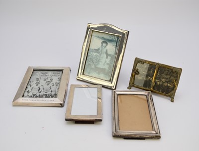 Lot 97 - Four silver mounted frames and a metal frame