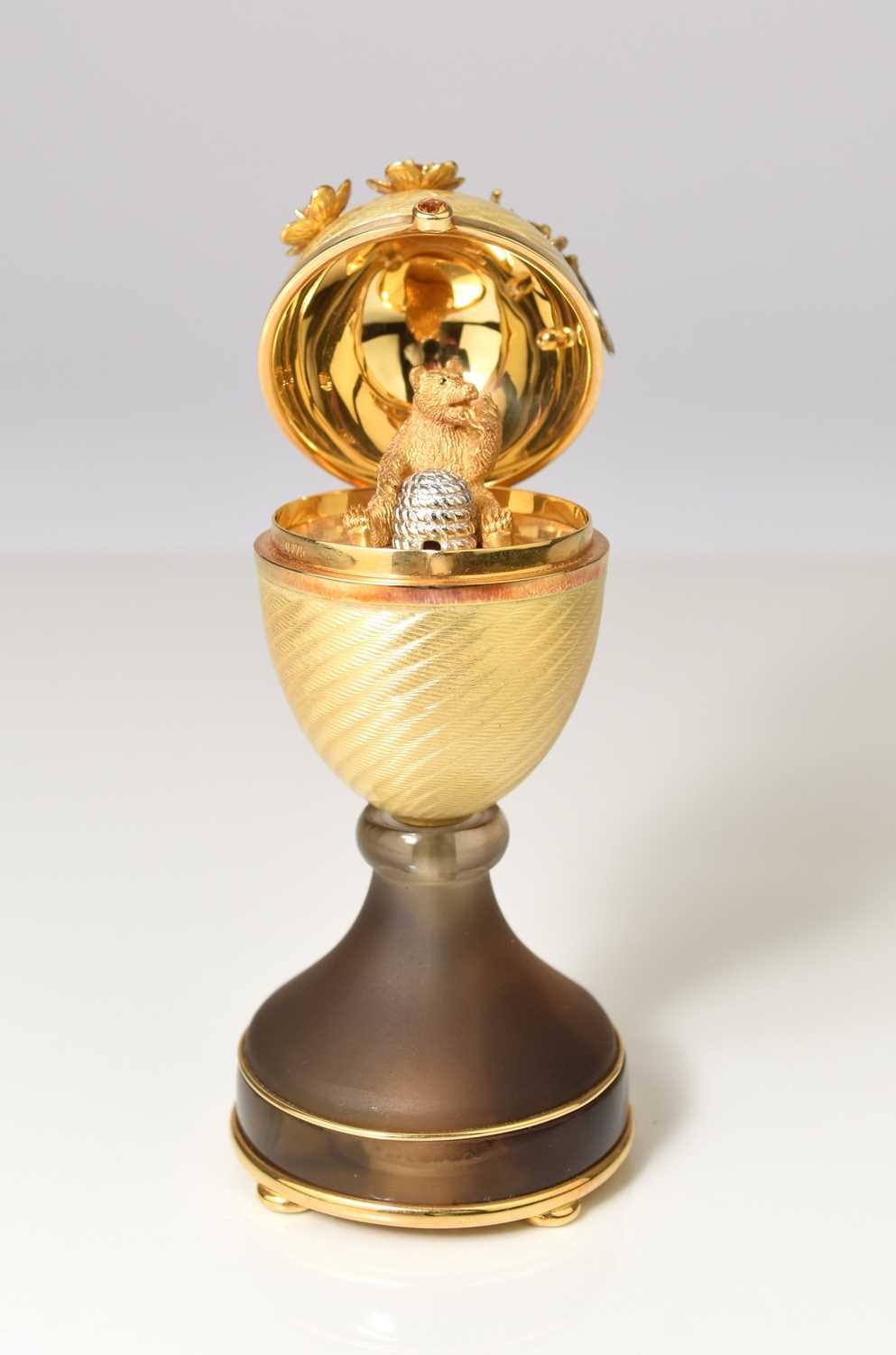 23 - Victor Mayer for Faberge; An 18ct gold, enamel, diamond, citrine and smoky quartz surprise egg