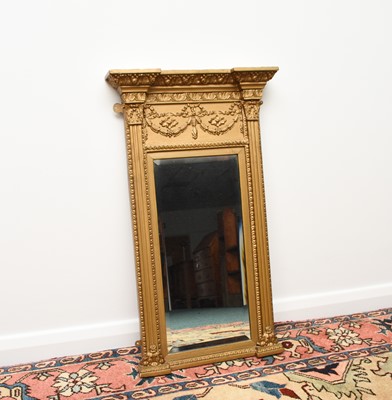 Lot 214 - A Regency Revival giltwood pier type wall mirror