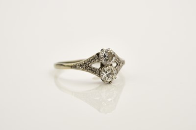 Lot 242 - A two stone diamond ring
