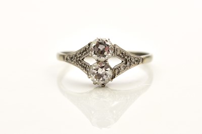 Lot 242 - A two stone diamond ring