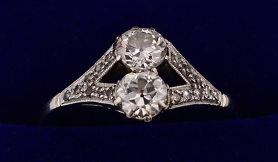 Lot 242 - A two stone diamond ring