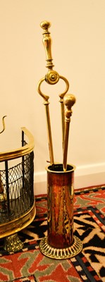 Lot 551 - A 19th century brass fire fender and accessories