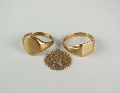 Lot 292 - Two 9ct gold signet rings and a 9ct gold St Christopher's pendant