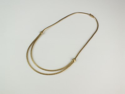 Lot 365 - A yellow metal two strand textured brick link necklace