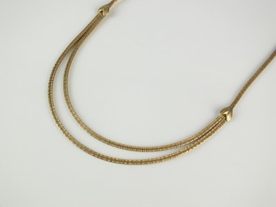 Lot 365 - A yellow metal two strand textured brick link necklace