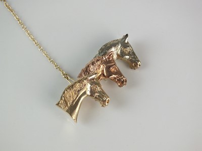 Lot 303 - A 9ct rose, yellow and white gold limited edition Rosemary Hetherington horse brooch