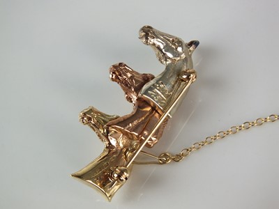 Lot 303 - A 9ct rose, yellow and white gold limited edition Rosemary Hetherington horse brooch
