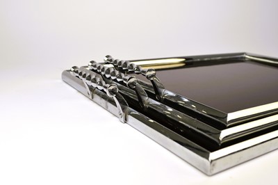 Lot 502 - A graduated set of three art deco style service trays