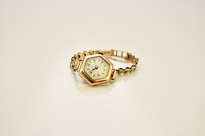 Lot 412 - Longines: A lady's 14ct gold watch on a 9ct bracelet