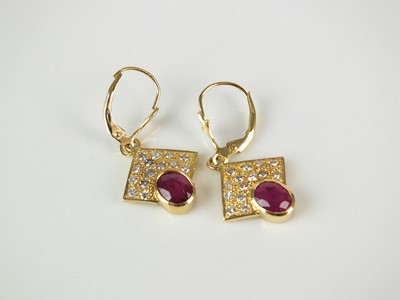 Lot 232 - A pair of ruby and diamond earrings